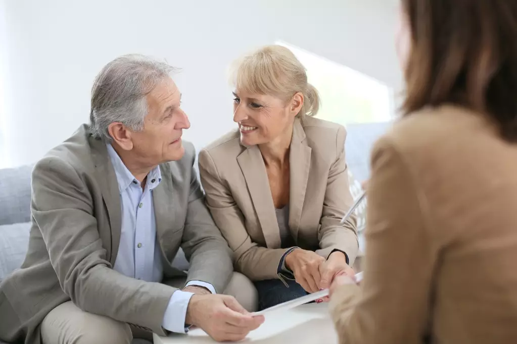 Senior couple meeting real estate agent